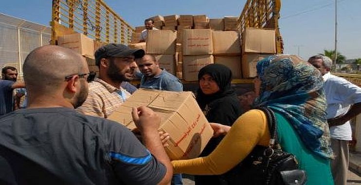 الهجرة توزع نحو 24 الف حصة اغاثية للنازحين وللعوائل في المناطق المحررة