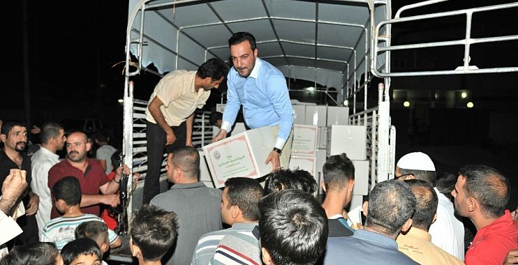 الهجرة ترسل /7800/ حصة اغاثية وتوزعها بين النازحين في مناطق جنوب الموصل وكركوك