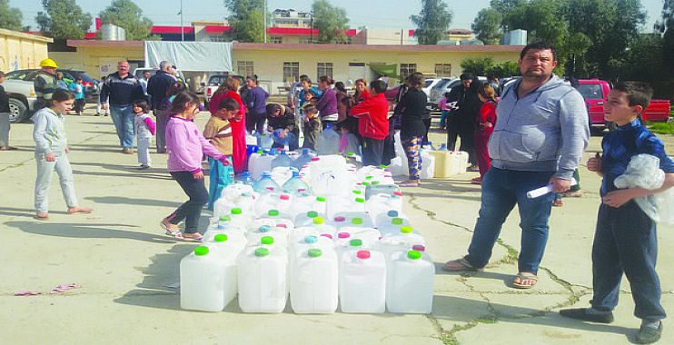 الهجرة توزع آلاف الحصص الإغاثية والنفط الأبيض بين النازحين